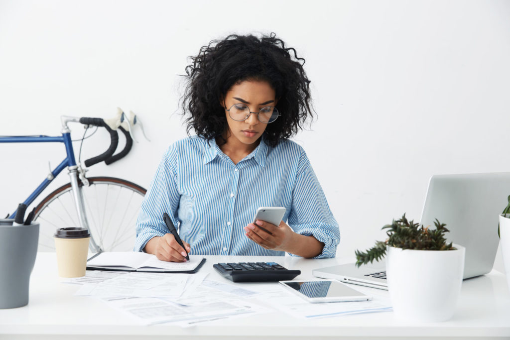 female accountant or banker making calculations at workp