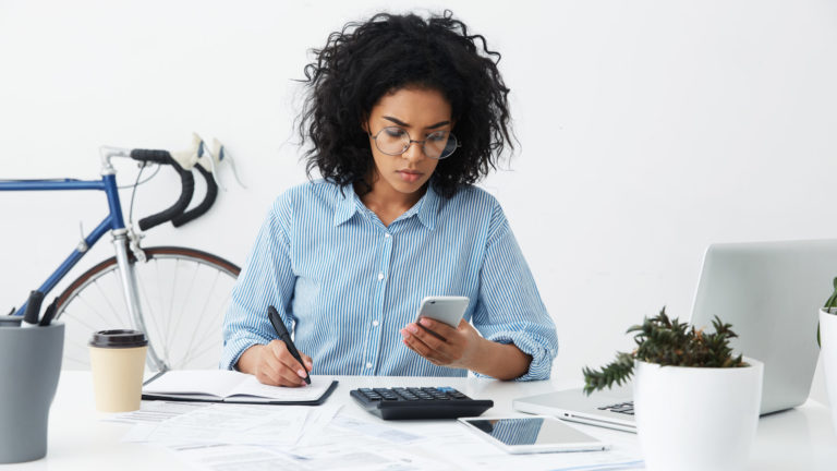 female accountant or banker making calculations at workp