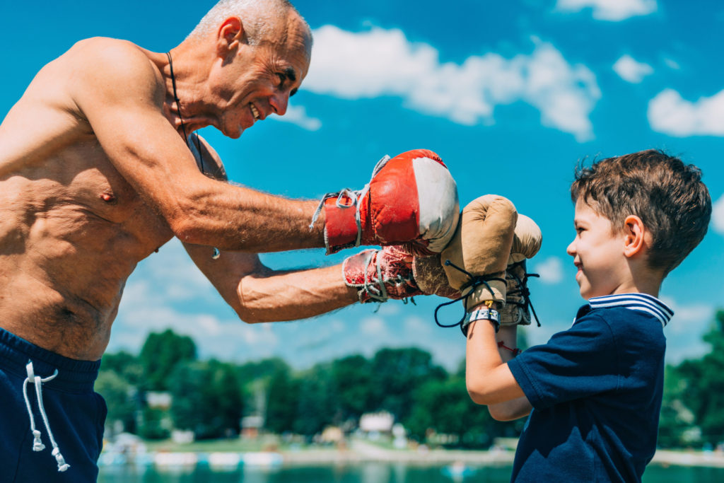 Small boxer with senior trainer