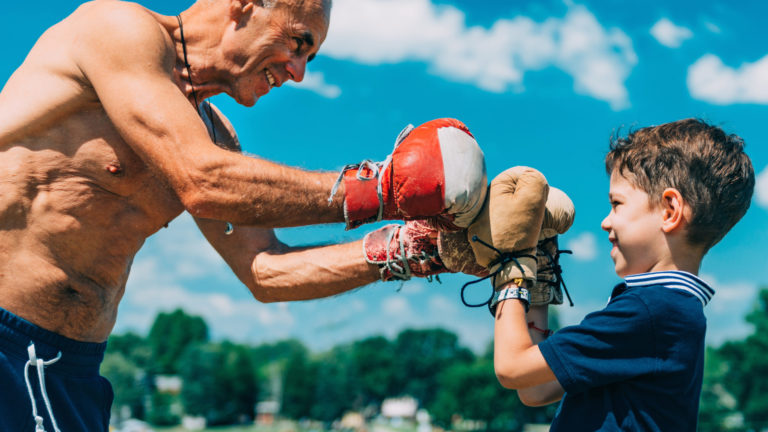 Small boxer with senior trainer